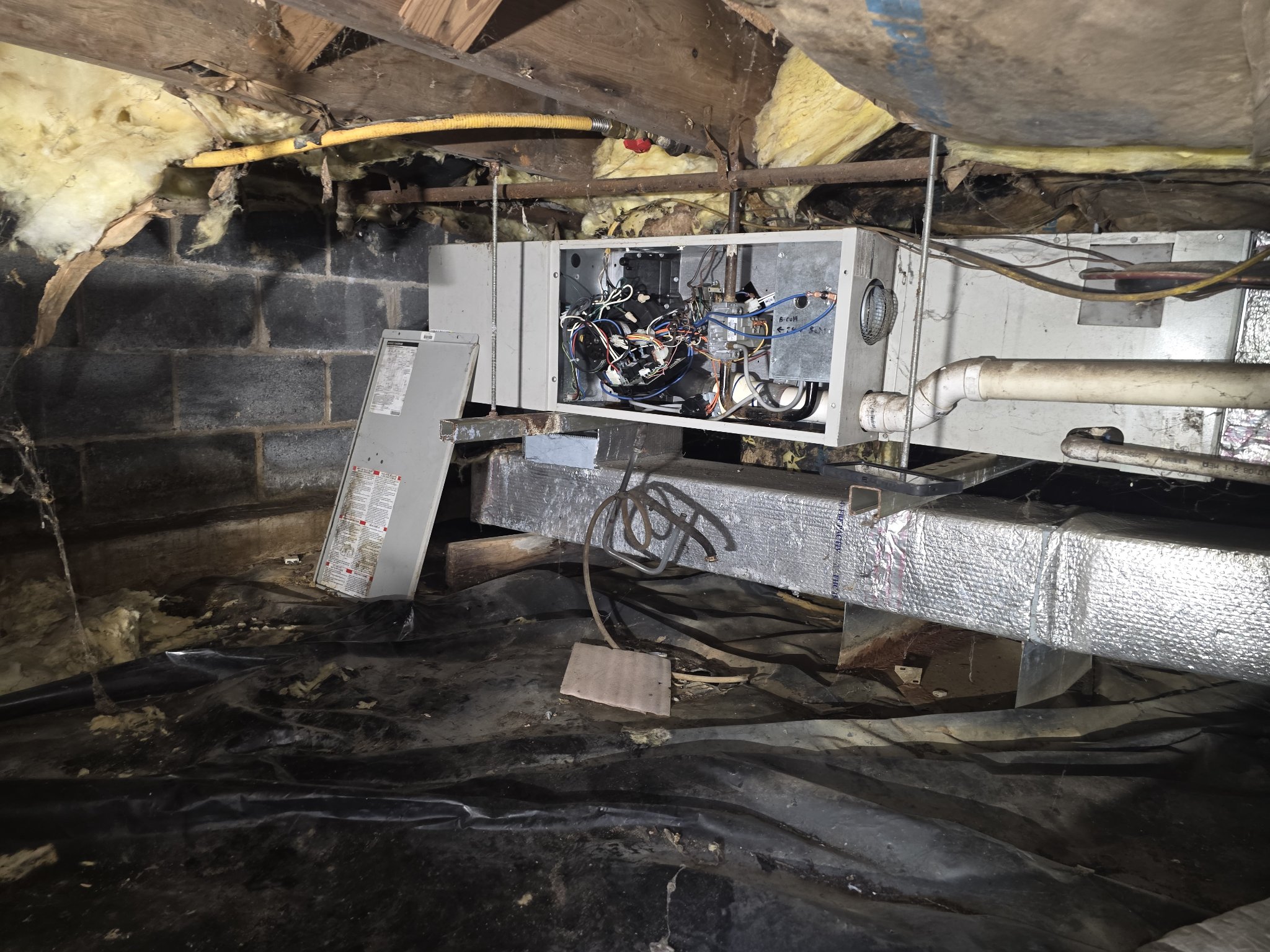 Air handler opened up for service in a crawlspace