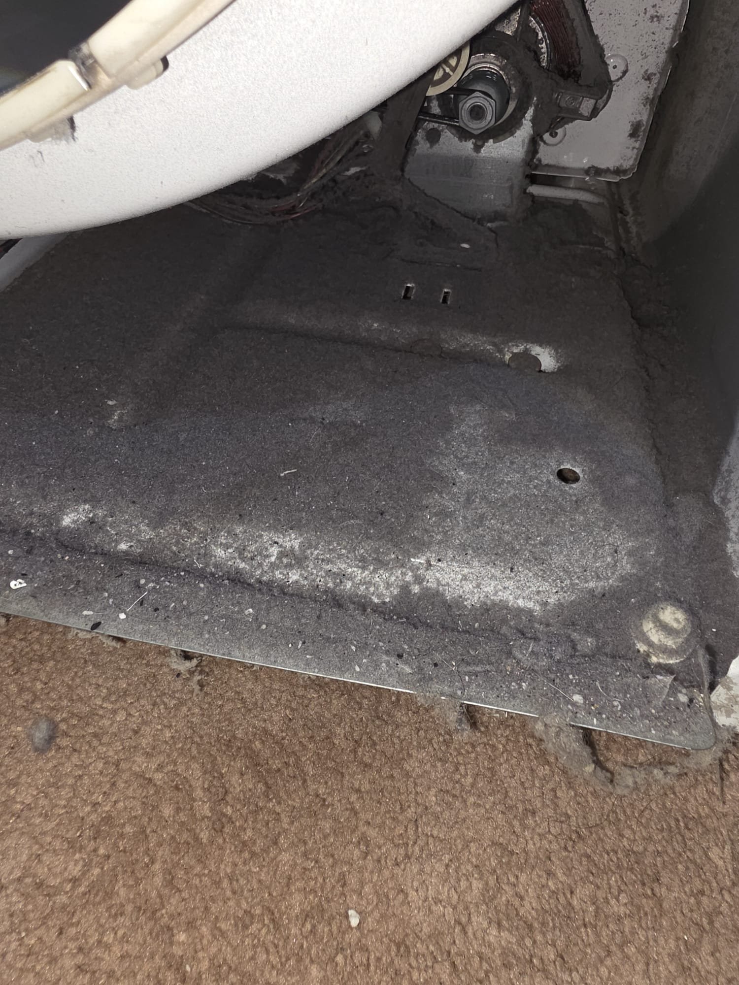 Dryer interior packed with lint before deep cleaning