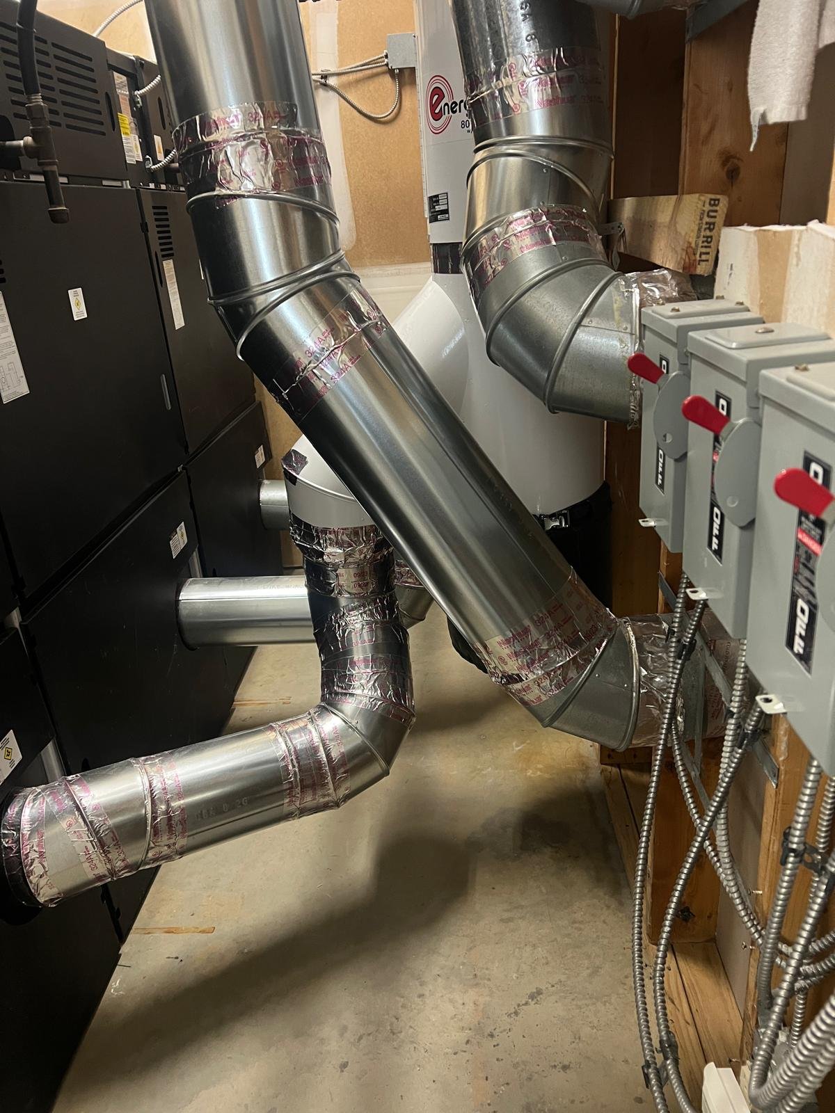 Commercial ductwork and mechanical room serviced by our techs