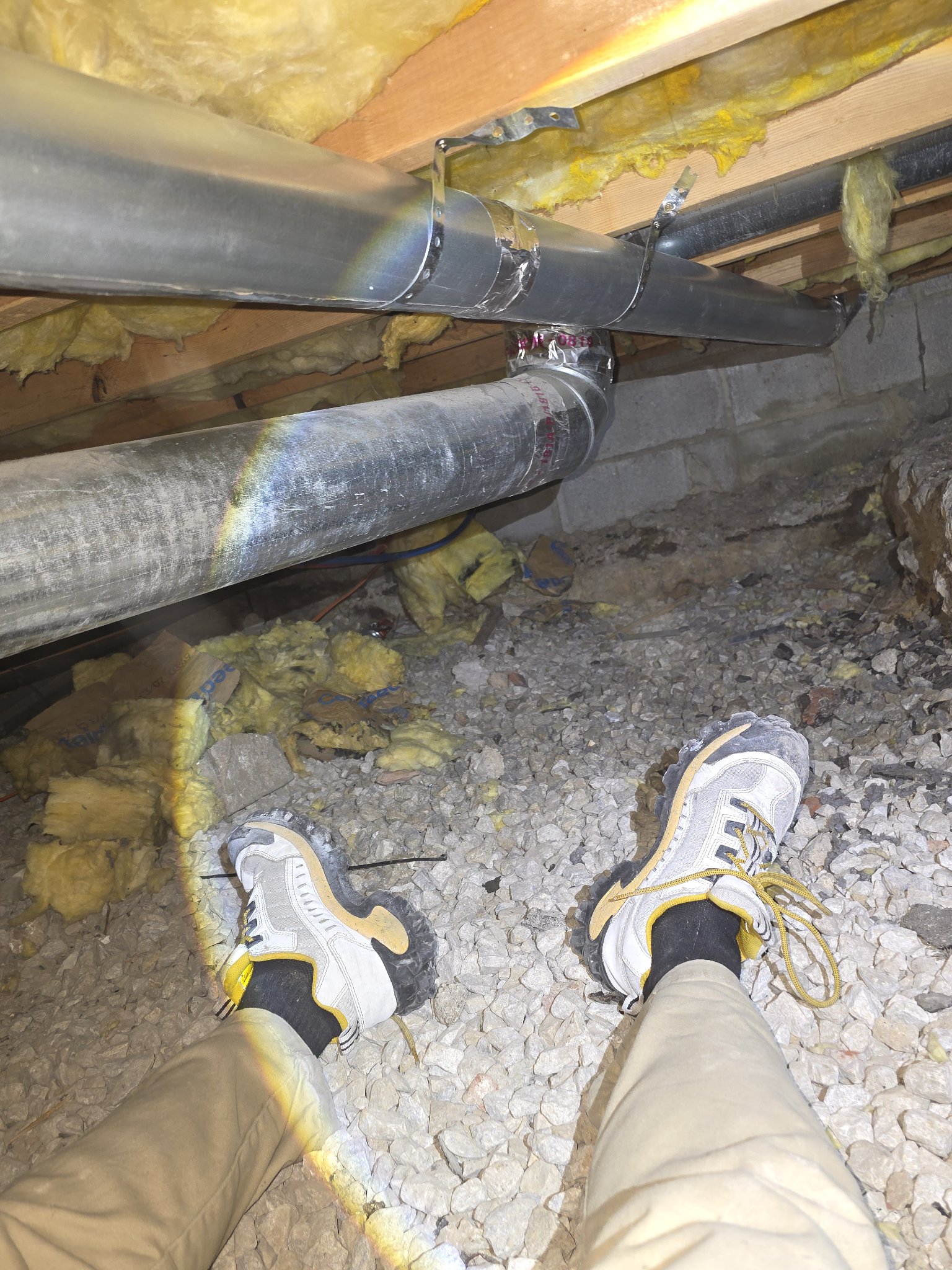New rigid metal dryer duct installed in a crawl space