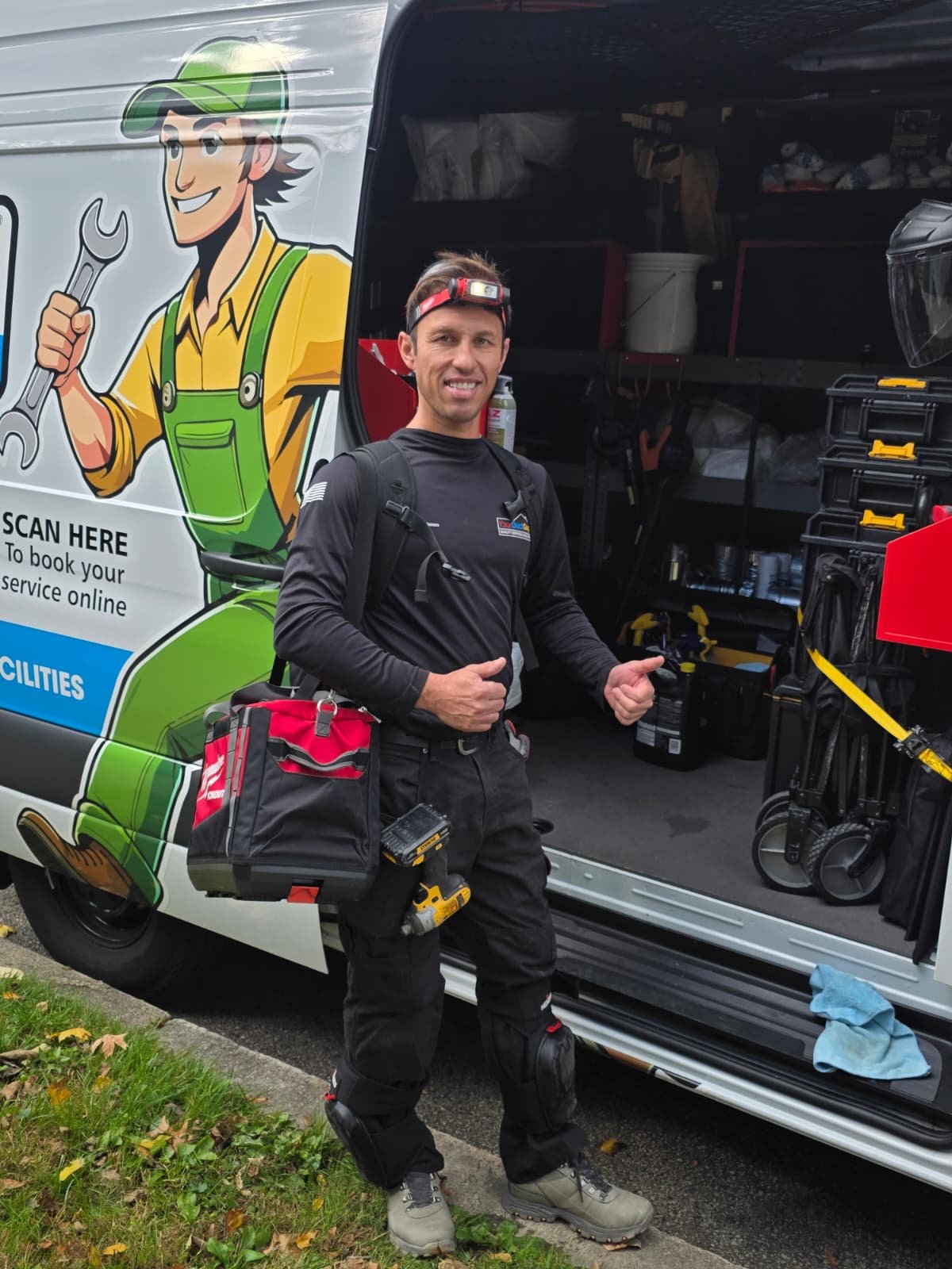 Technician with fully equipped truck ready for service