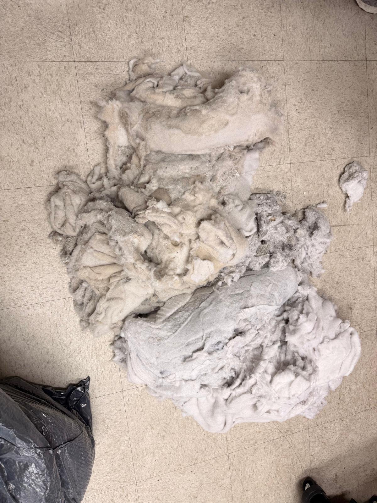 Pile of lint pulled out of a clogged dryer vent