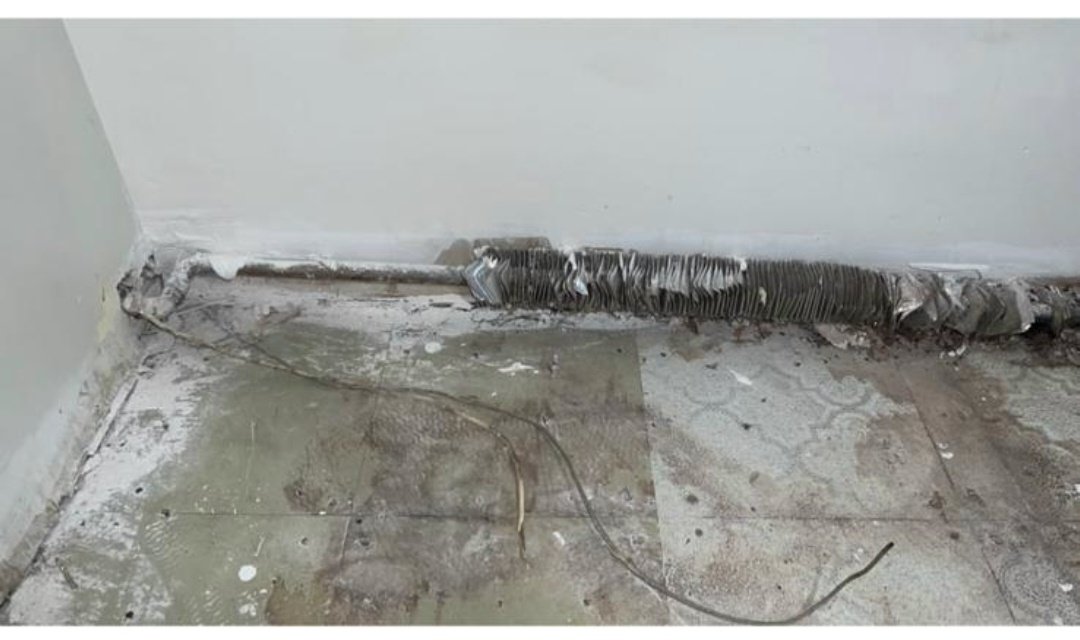 Before — Old Baseboard Heater