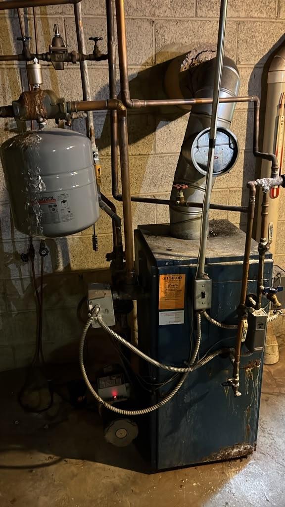 Old rusted boiler before replacement