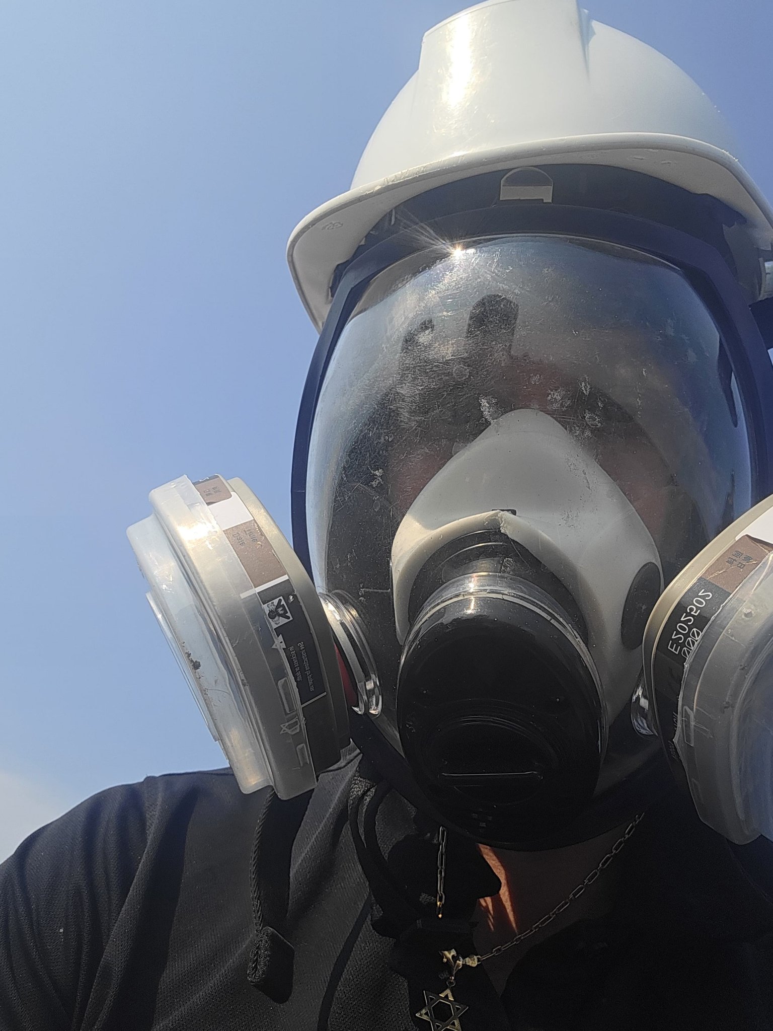 Technician On A Hotel Roof In Protective Gear
