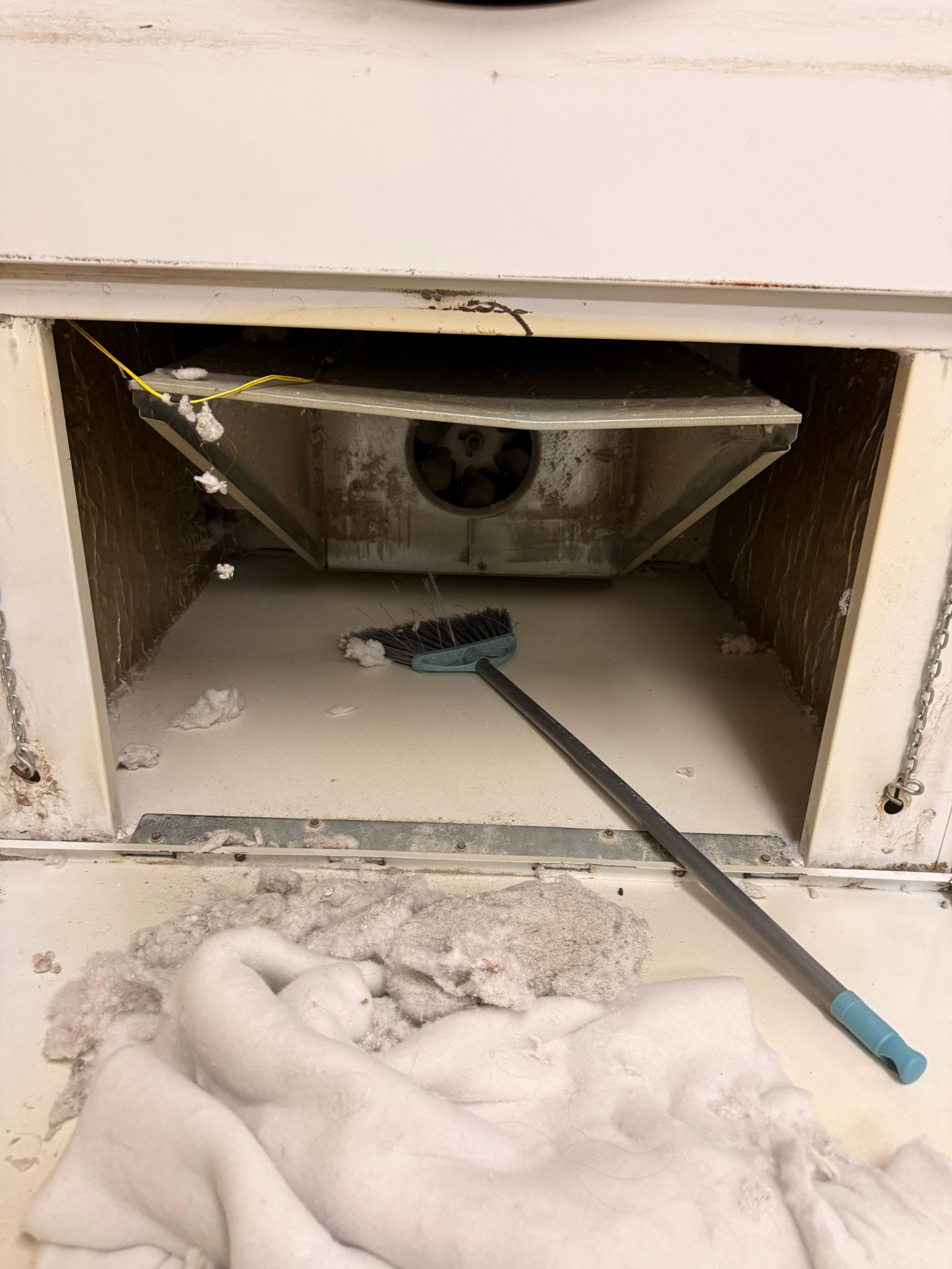 Cleaning A Hotel Dryer Cabinet And Removing Lint