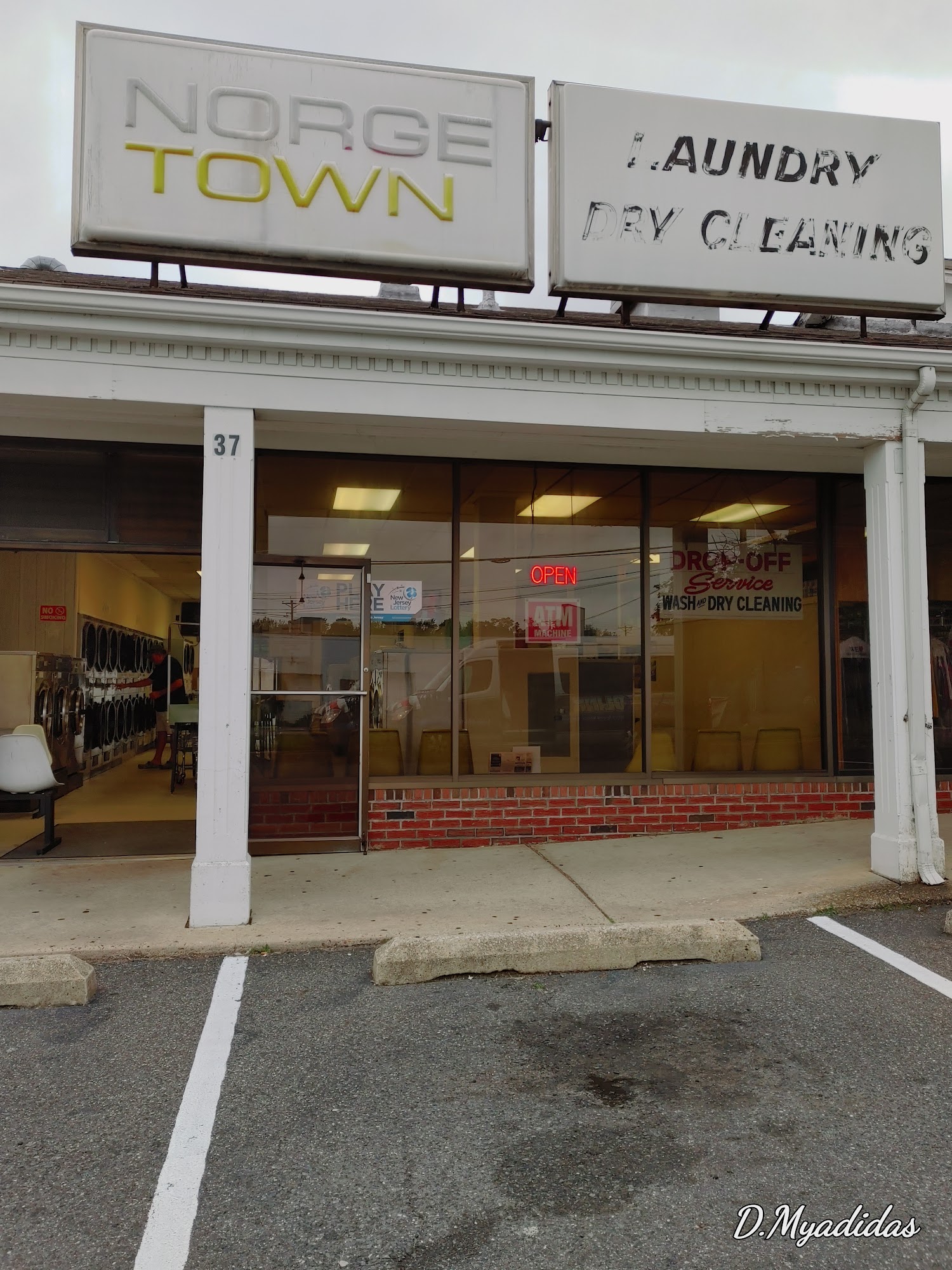 Laundromat Storefront With Dry Cleaning Service
