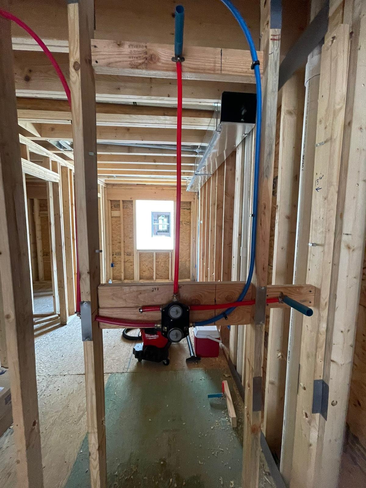 Technician installing underground sewer pipes